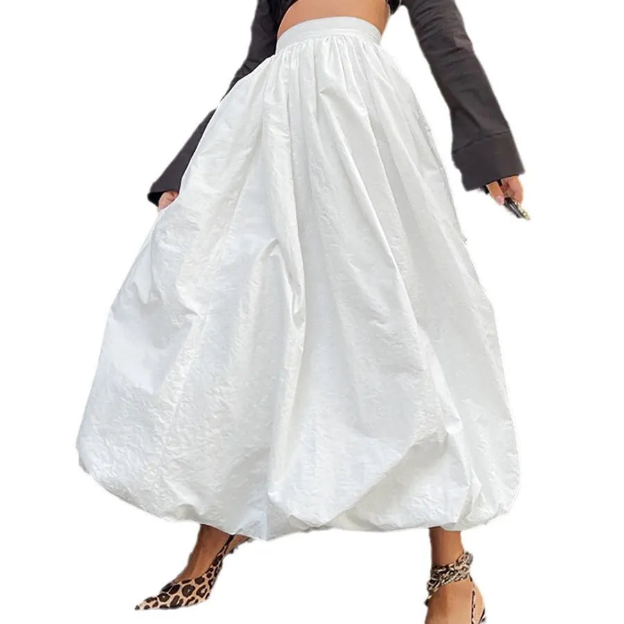 Women's long solid colour cotton skirt with elastic waist in black or white.