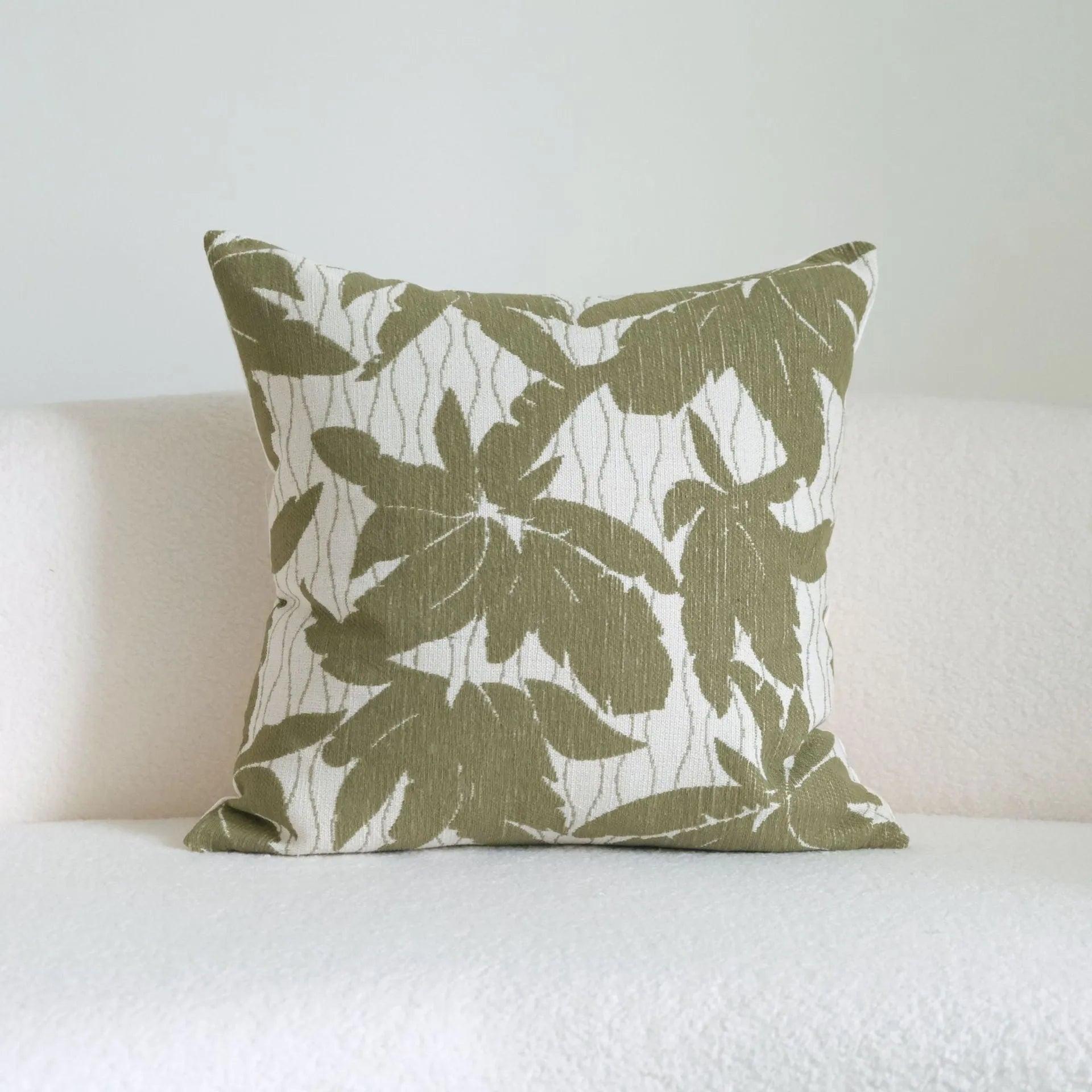 Green cotton linen hotel sample pillow with tassel detail in striped or leaf patterns