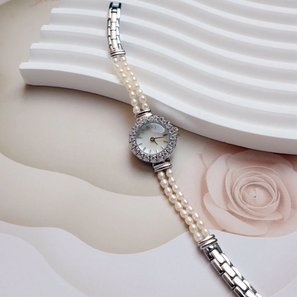 Women's light gold bracelet watch with natural freshwater pearls and round 18mm dial