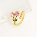 Copper geometric open ring with detailed leaf pattern and gold zircon accents