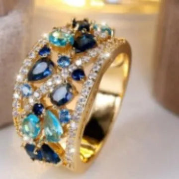 Women's round hollow ring in gold or platinum with sapphire blue or diamond settings