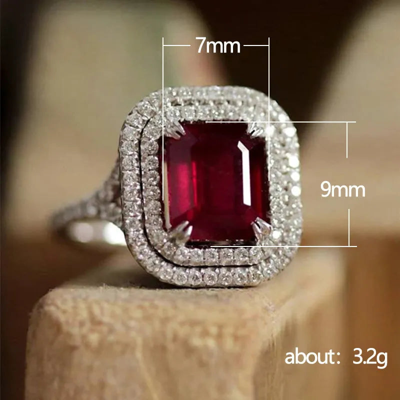 Square red copper women's ring with a central rhinestone on a white background.