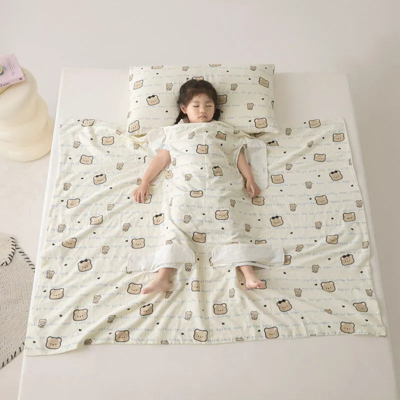 Anti-kick sleeping bag blanket in a colourful Cloud Bear Star Dream design on a bed.