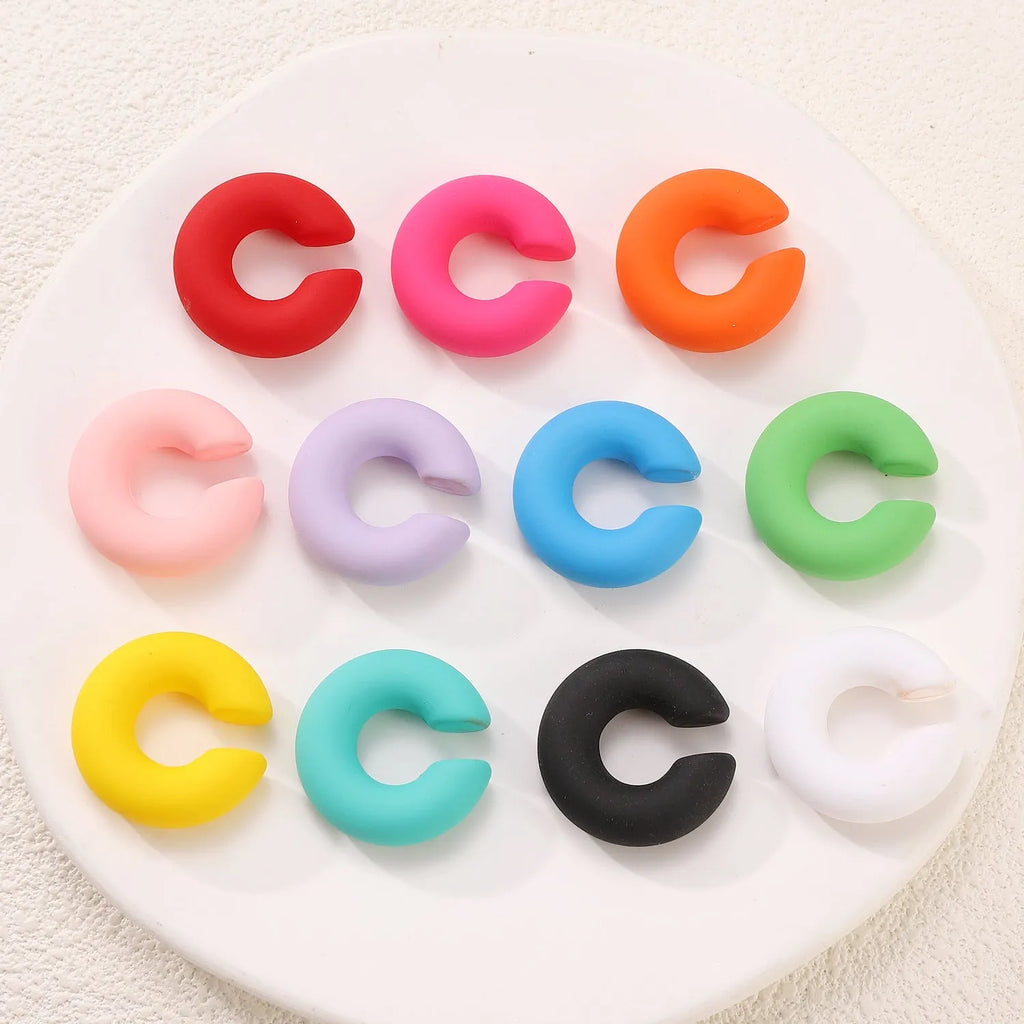 Matte coarse finish geometric C-shaped clip-on earrings for women in a selection of candy colours.