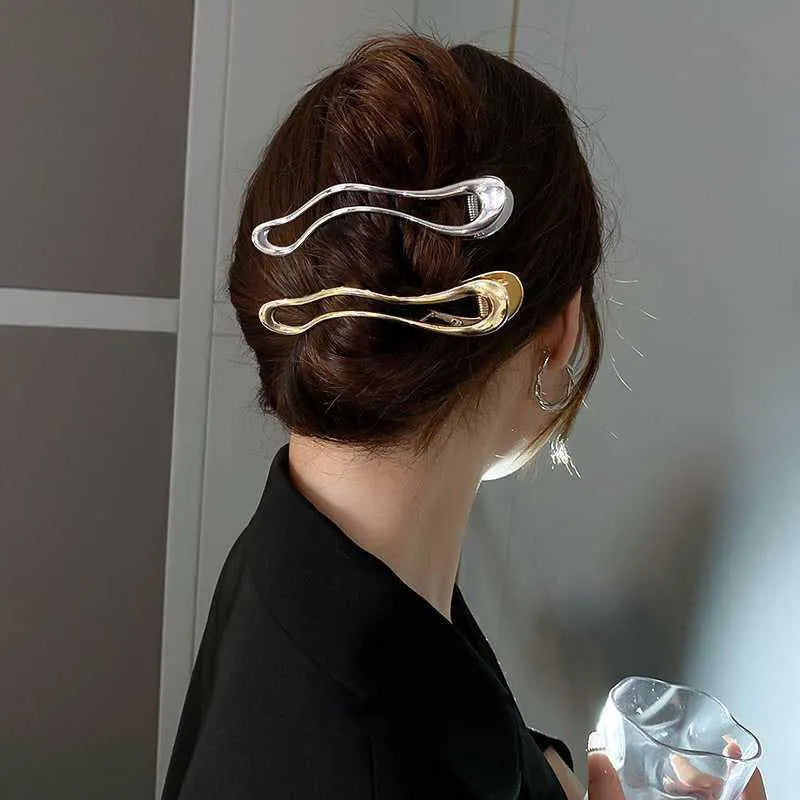 Gold and silver zinc alloy hair barrettes in square, arc, and triangle shapes.