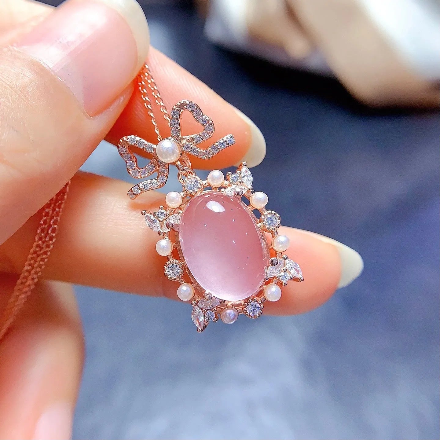 Geometric pendant necklace with pink rose quartz, silver chain, and rose gold plating