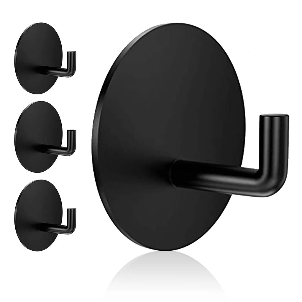 Two stainless steel self-adhesive hooks on a surface, one black and one polished.