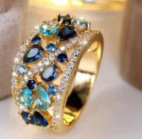 Women's round hollow ring in gold or platinum with sapphire blue or diamond settings