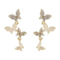 Women's copper butterfly earrings with four butterfly design in gold tone drop style