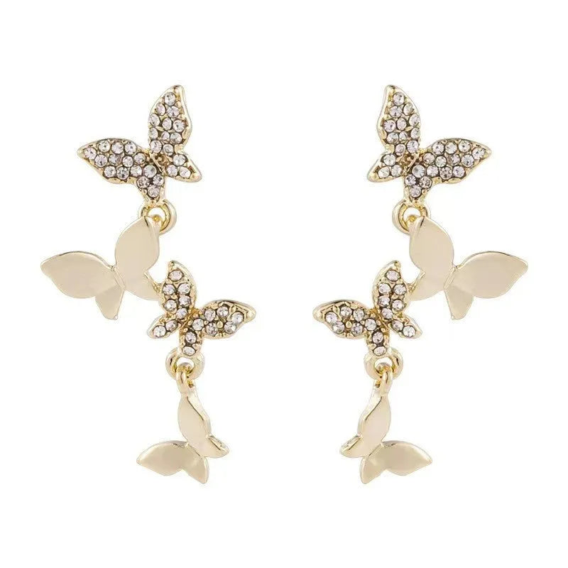 Women's copper butterfly earrings with four butterfly design in gold tone drop style