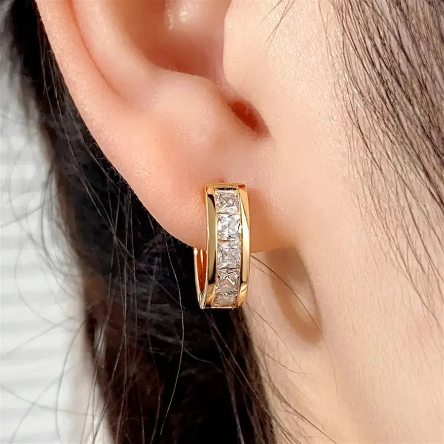 Geometric quadrilateral copper earrings with gold finish and post fastening