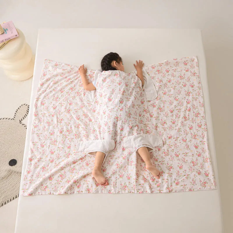 Anti-kick sleeping bag blanket in a colourful Cloud Bear Star Dream design on a bed.
