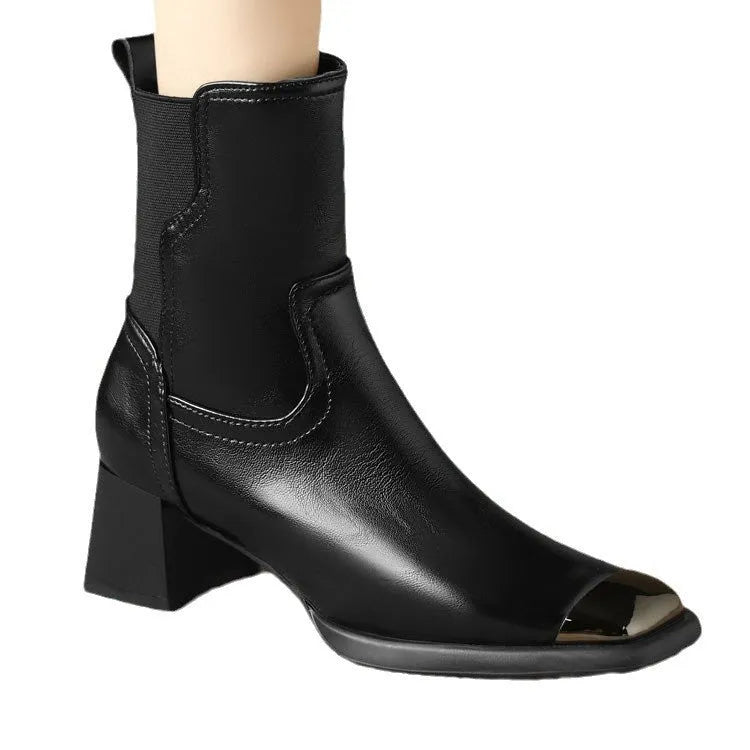 Brown women's Martin heeled leather boots with side zipper and metal rivet details.