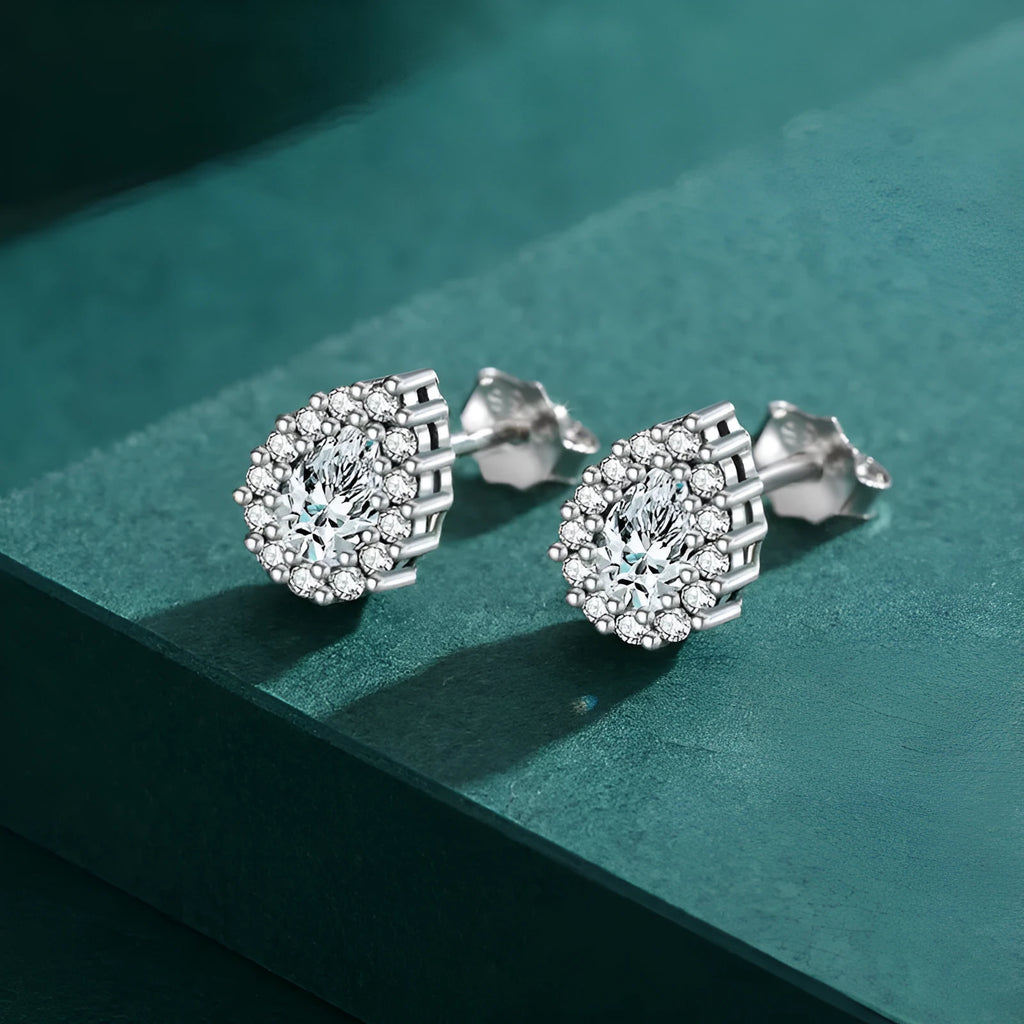 Women's silver water drop ear studs in 925 sterling silver with diamond treatment