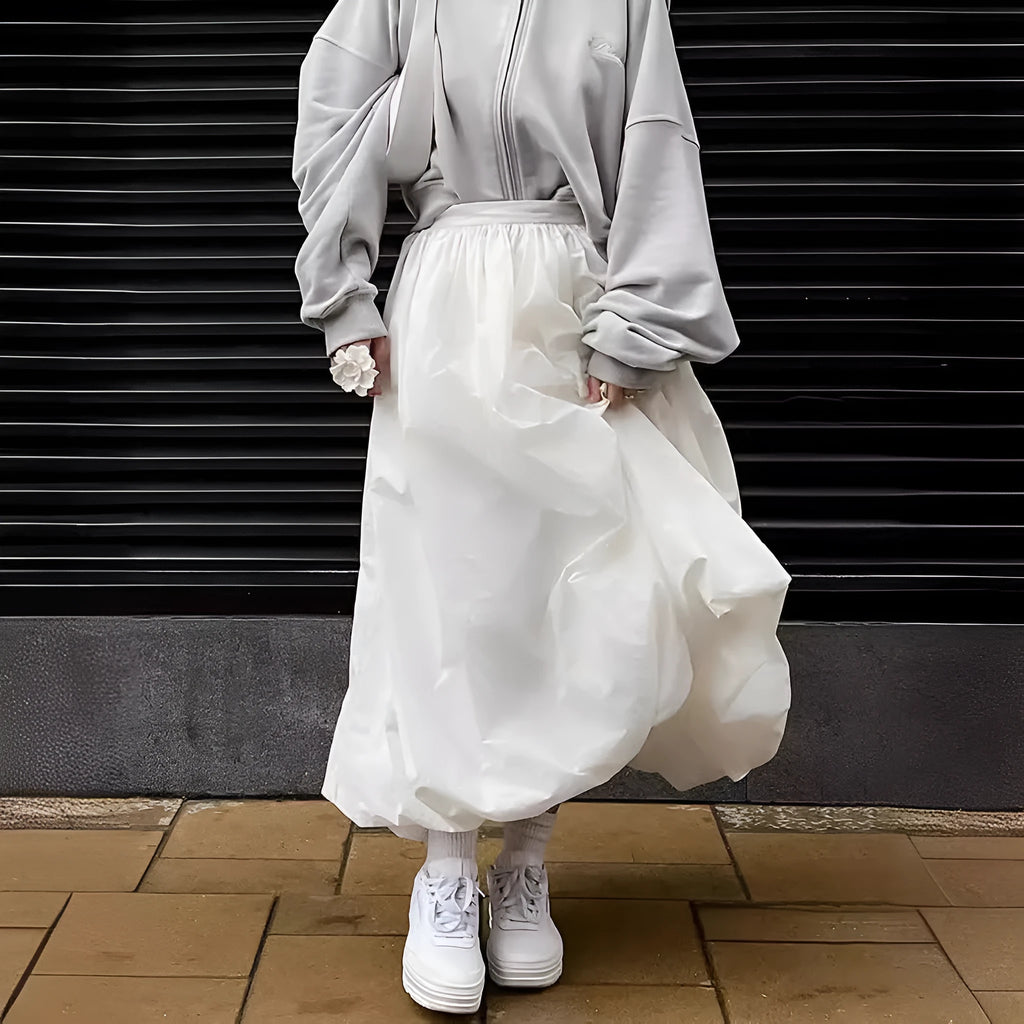Women's long solid colour cotton skirt with elastic waist in black or white.