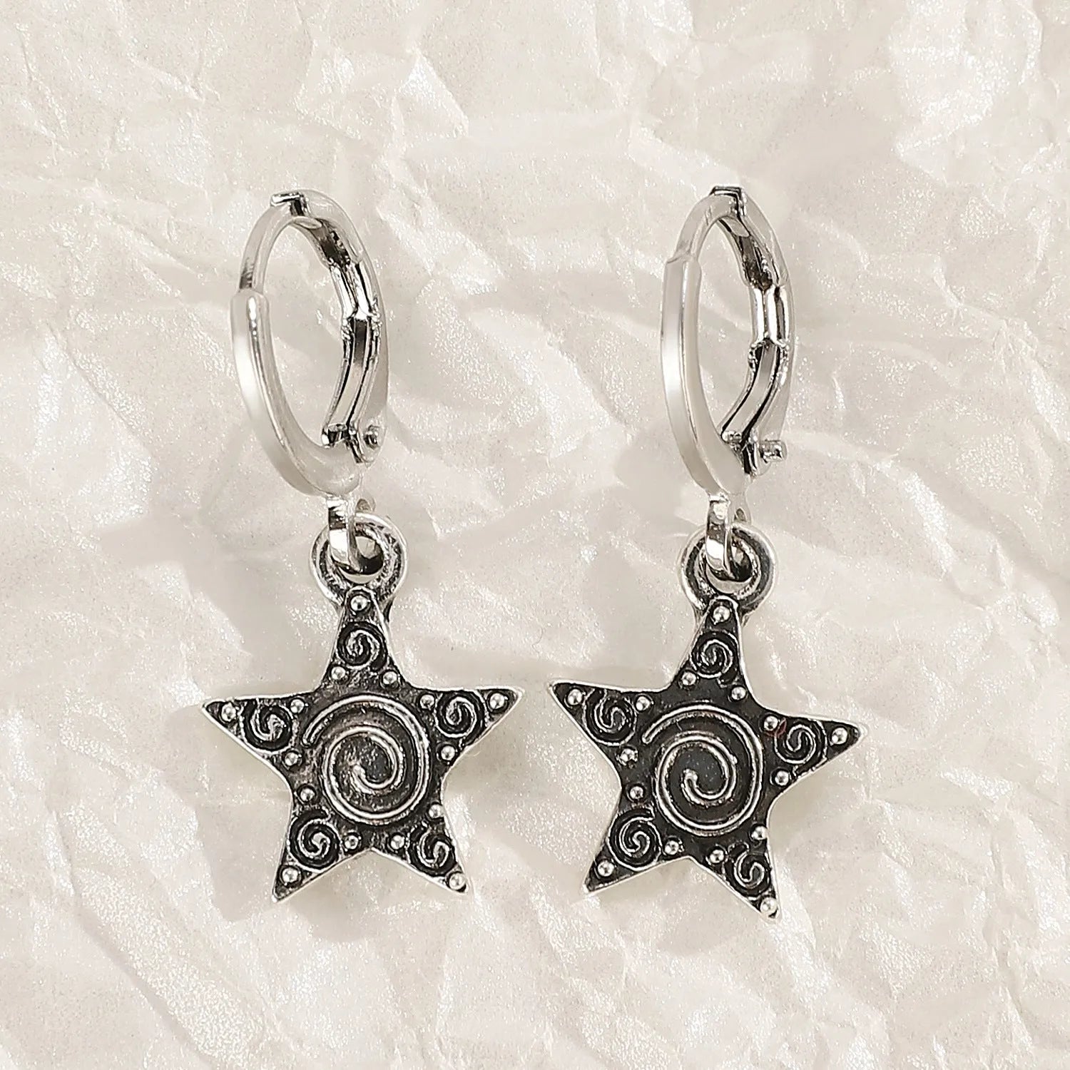 Women's alloy cross crystal earrings in white, bright black, and antique silver colours with geometric animal designs