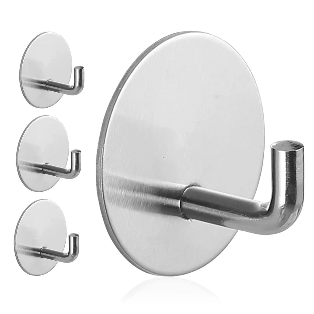 Two stainless steel self-adhesive hooks on a surface, one black and one polished.