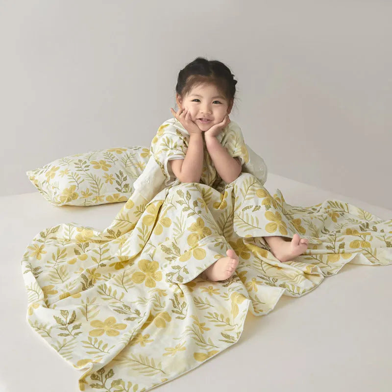 Anti-kick sleeping bag blanket in a colourful Cloud Bear Star Dream design on a bed.