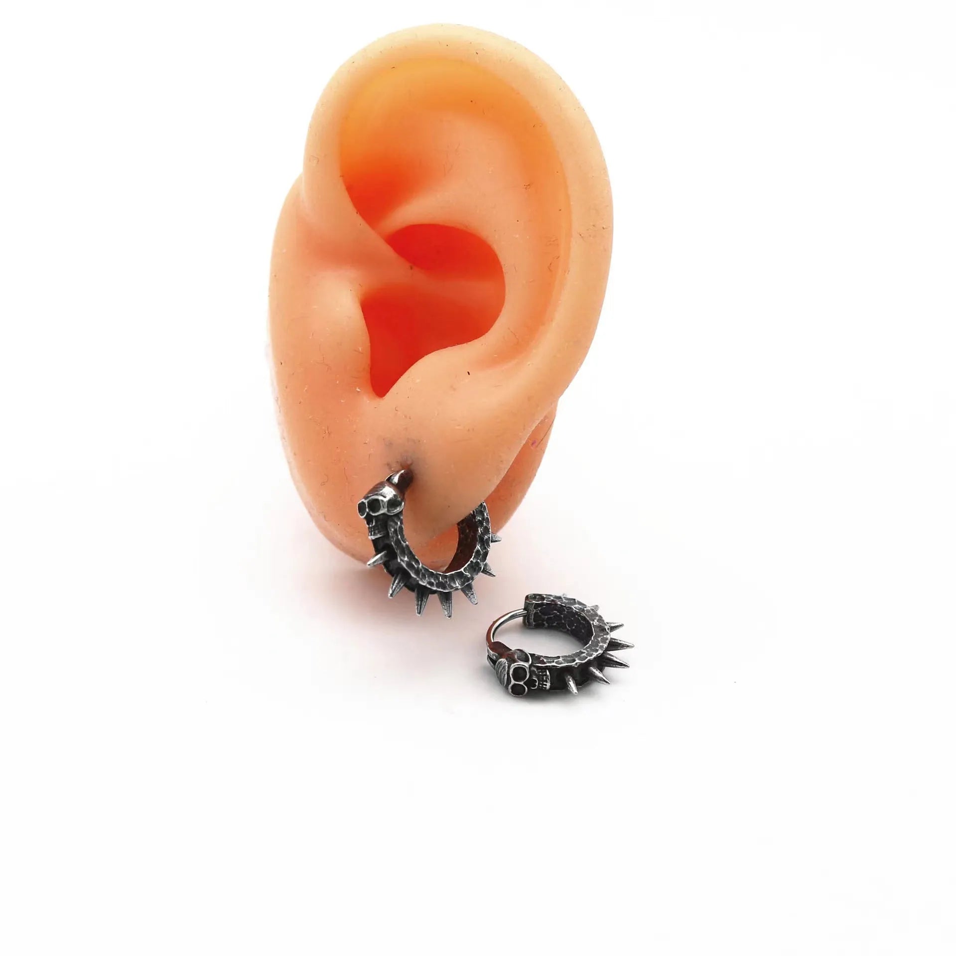Geometric black motorcycle earrings with copper plastic punk detailing on alloy backing