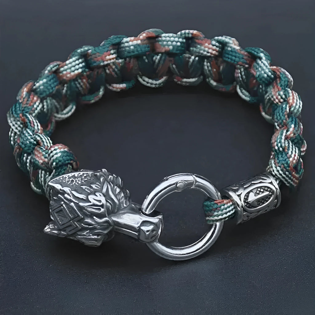 Handmade titanium steel wolf head bracelet in camouflage colour on wrist.