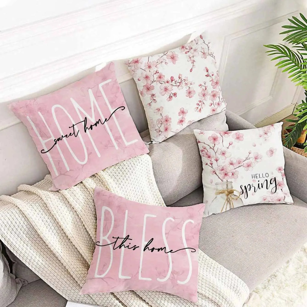 45cm square cherry blossom print cushion cover in short velvet fabric on a grey sofa.