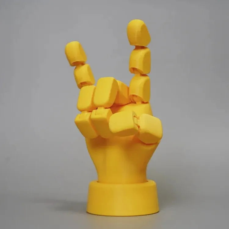 Yellow PLA plastic movable joint hand prop ornament with articulated fingers.