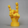 Yellow PLA plastic movable joint hand prop ornament with articulated fingers.