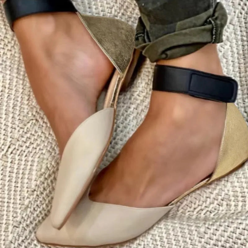 Women's beige hollowed sandals with adjustable velcro straps, shown from the side.