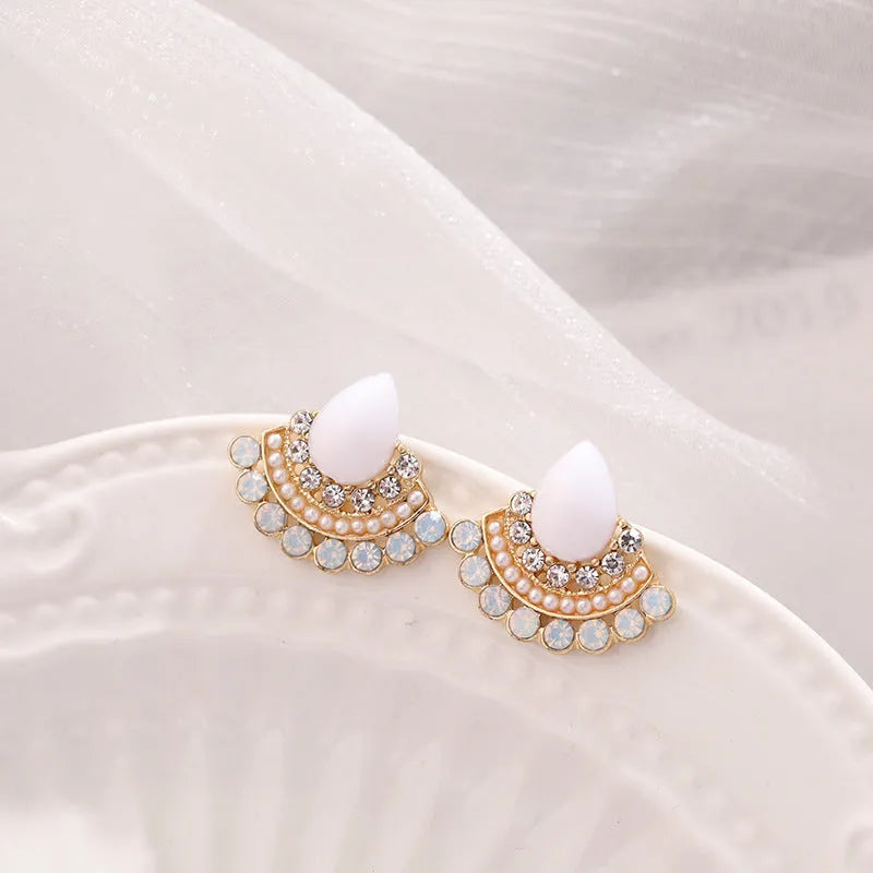 Women's silver geometric fan-shaped drop earrings with a central opal rhinestone.