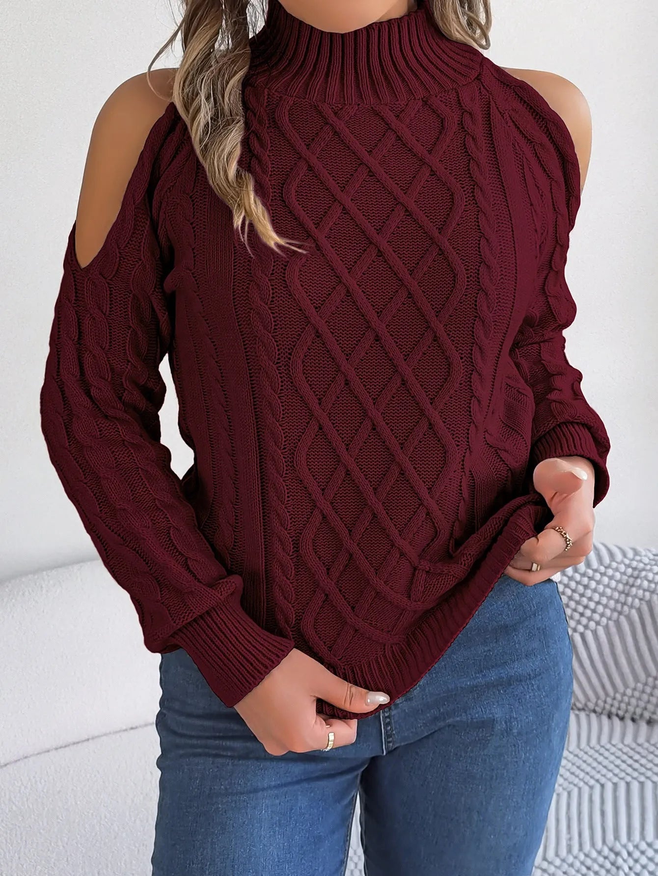 Women's gray acrylic sweater with twisted pattern, strapless half-high collar, and long lantern sleeves.