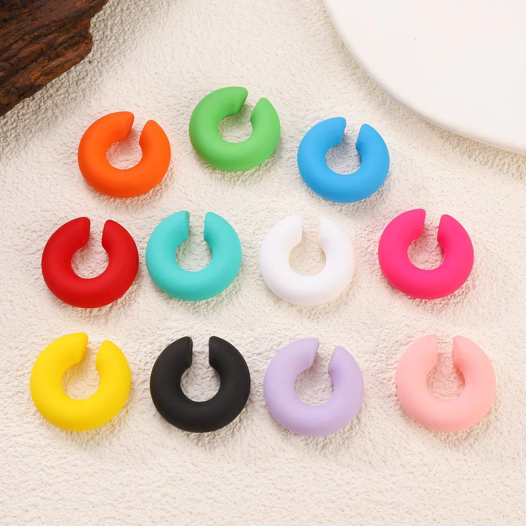 Matte coarse finish geometric C-shaped clip-on earrings for women in a selection of candy colours.