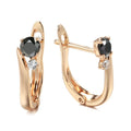 Gold geometric drop shape earrings with retro design and stone inlay on copper.