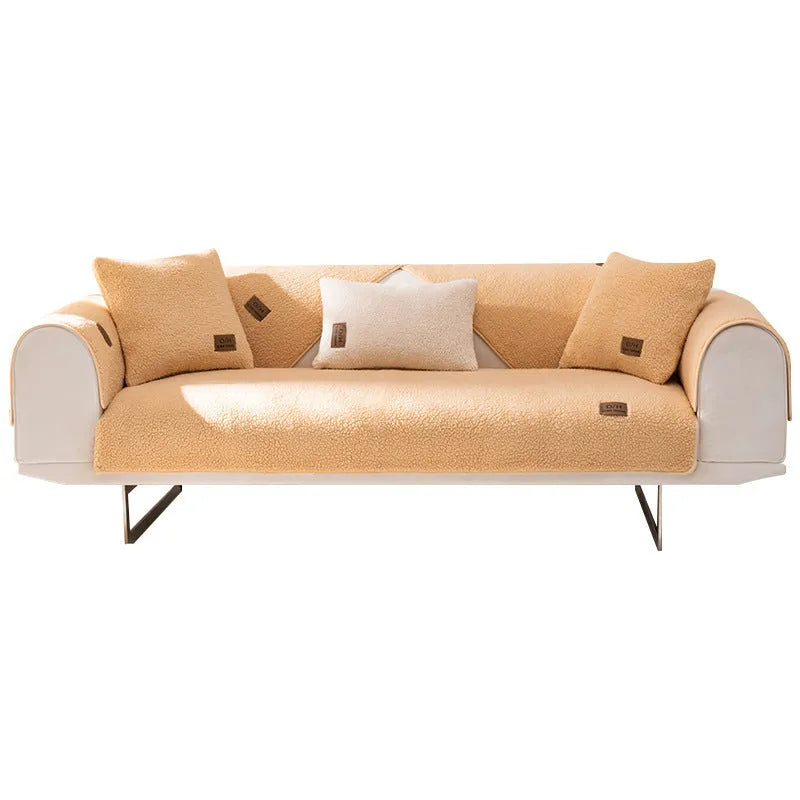 Lambswool solid colour sofa cover in blue, shown on a three-seater sofa.
