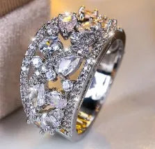 Women's round hollow ring in gold or platinum with sapphire blue or diamond settings