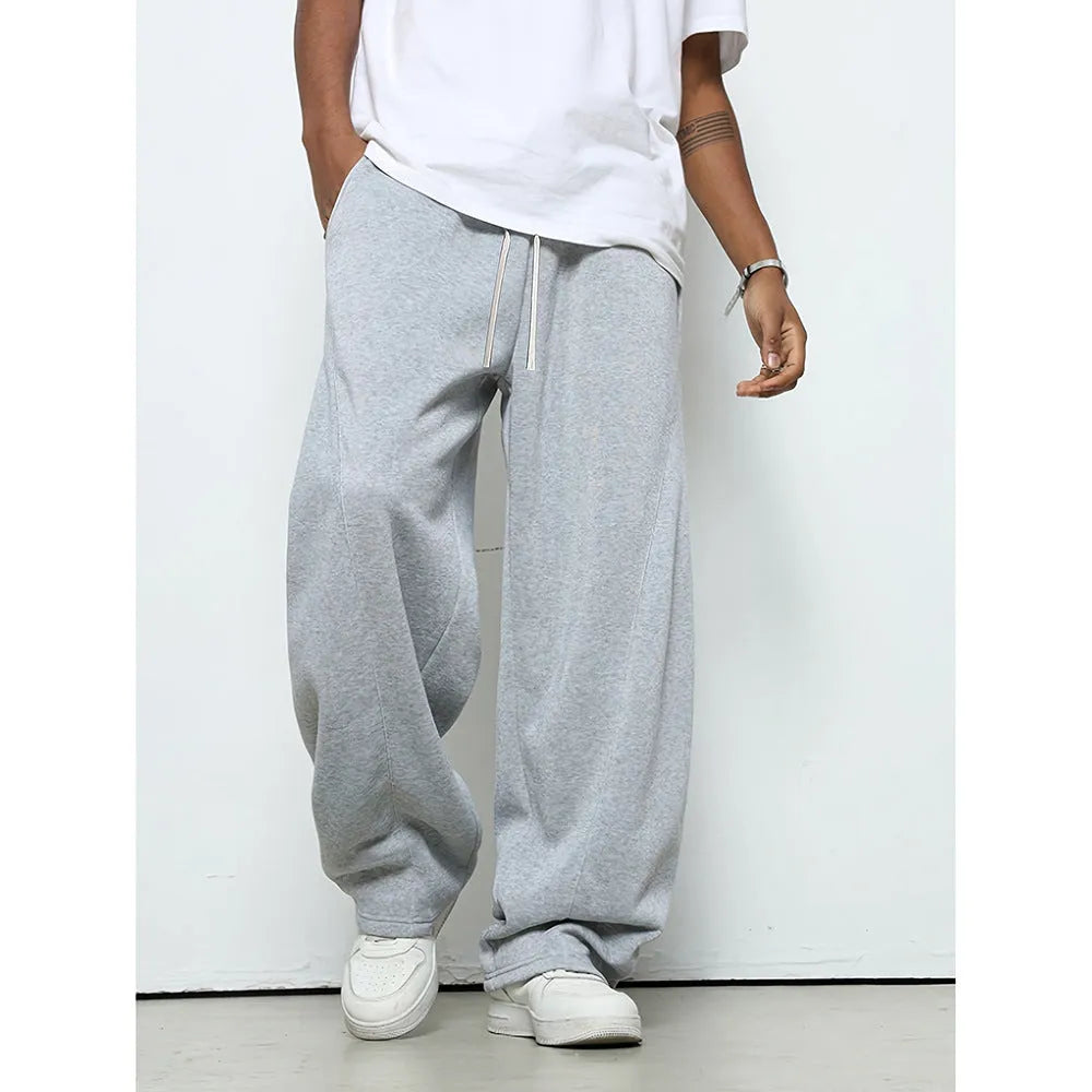 Men's straight-leg casual trousers in black with a micro-elastic waistband and drawstring closure.