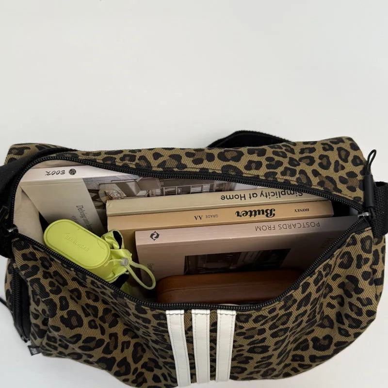 Leopard print sports style shoulder messenger bag with cross-body strap and stitching details