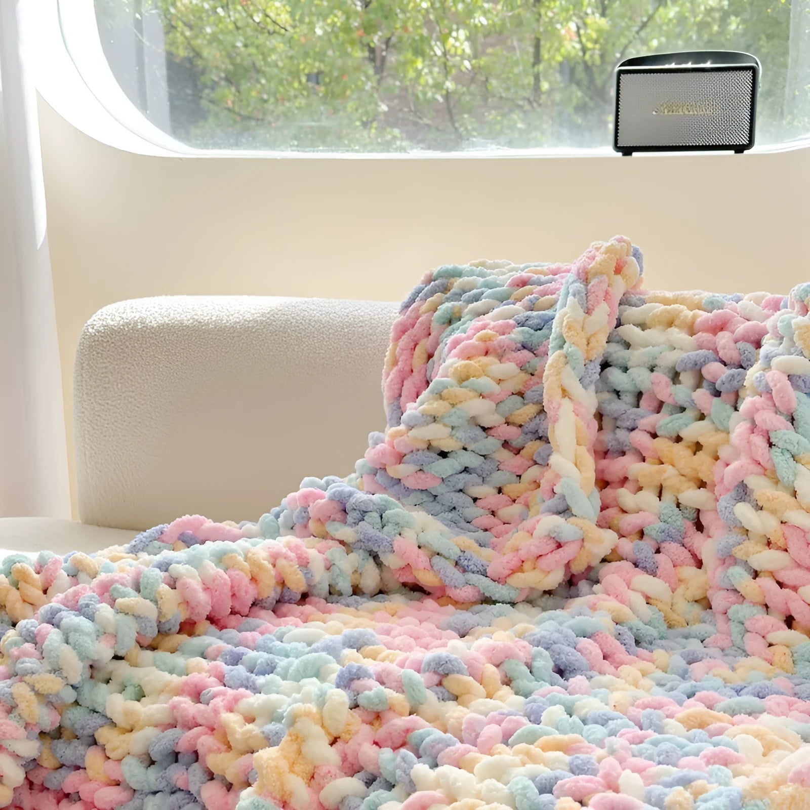 Thick striped chenille handmade blanket in a choice of four colours, shown on a double bed.