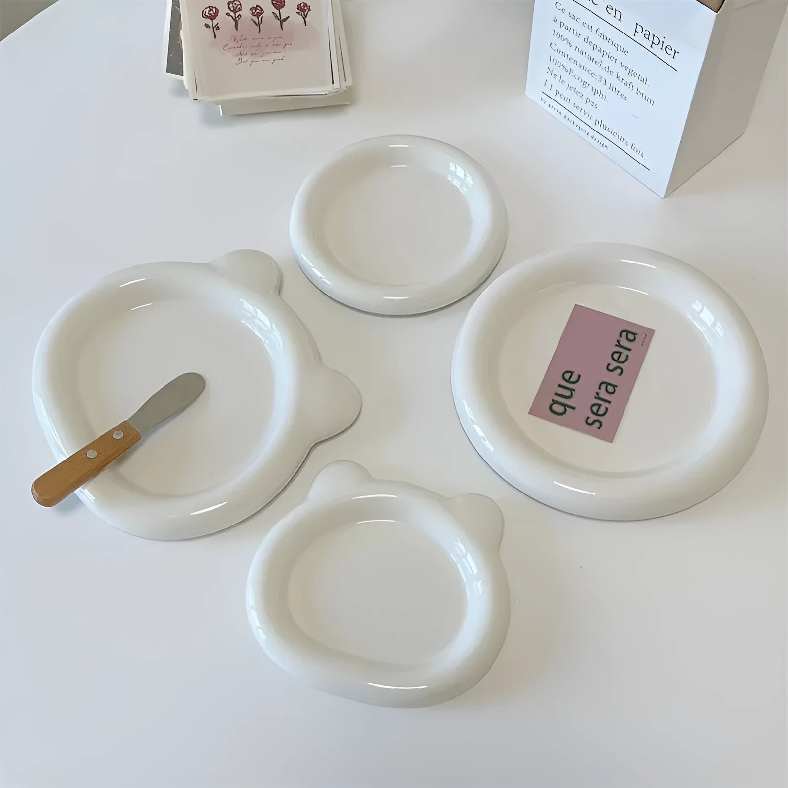 White porcelain plate with bear doodle or round doodle design, shown in 15cm and 20cm sizes.