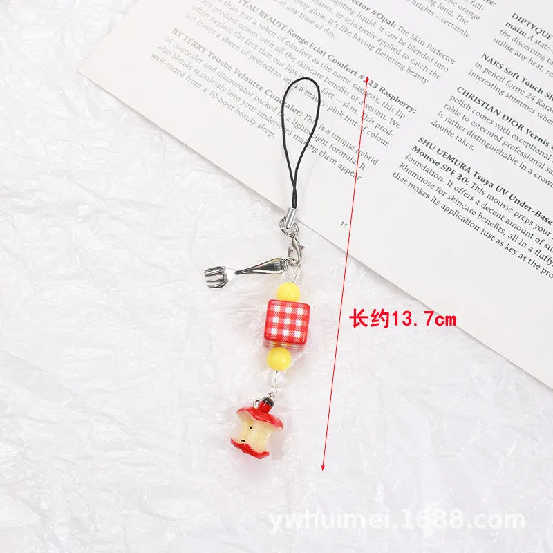 Plastic resin fruit pattern phone charm keychain pendant with apple and strawberry designs on a white rope.