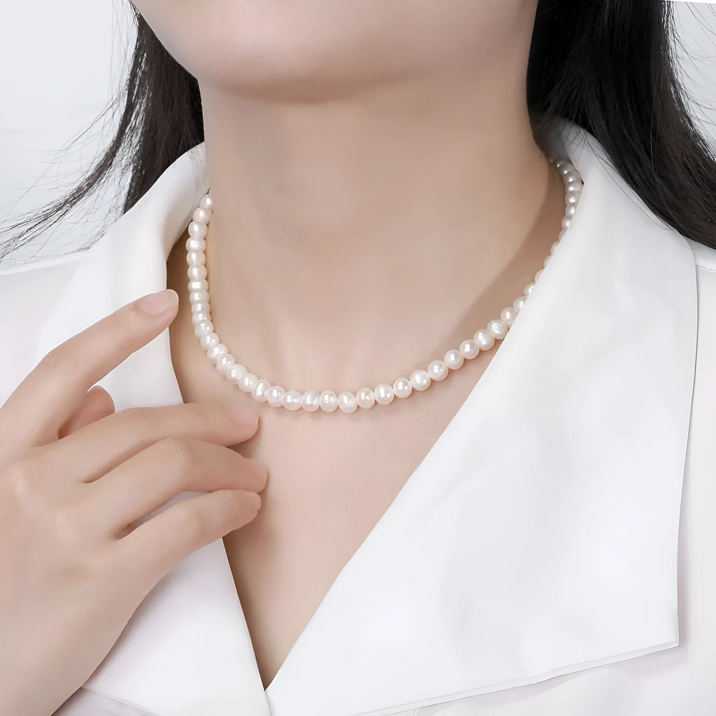 Women's adjustable necklace with 6-7mm natural freshwater pearls on a 925 sterling silver chain.