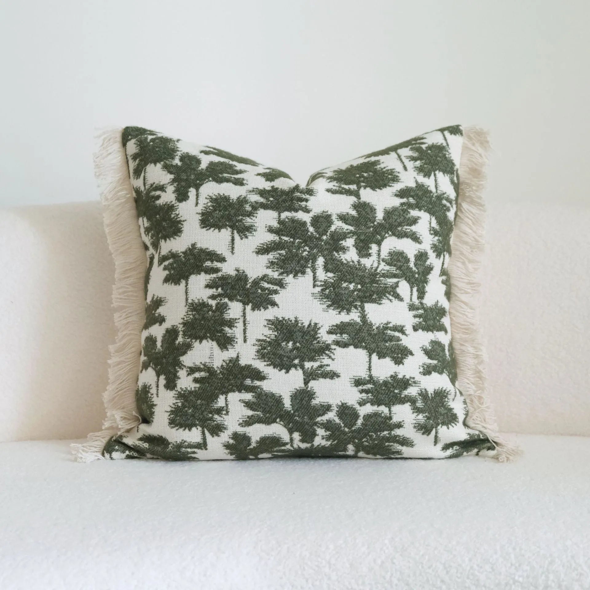 Green cotton linen hotel sample pillow with tassel detail in striped or leaf patterns