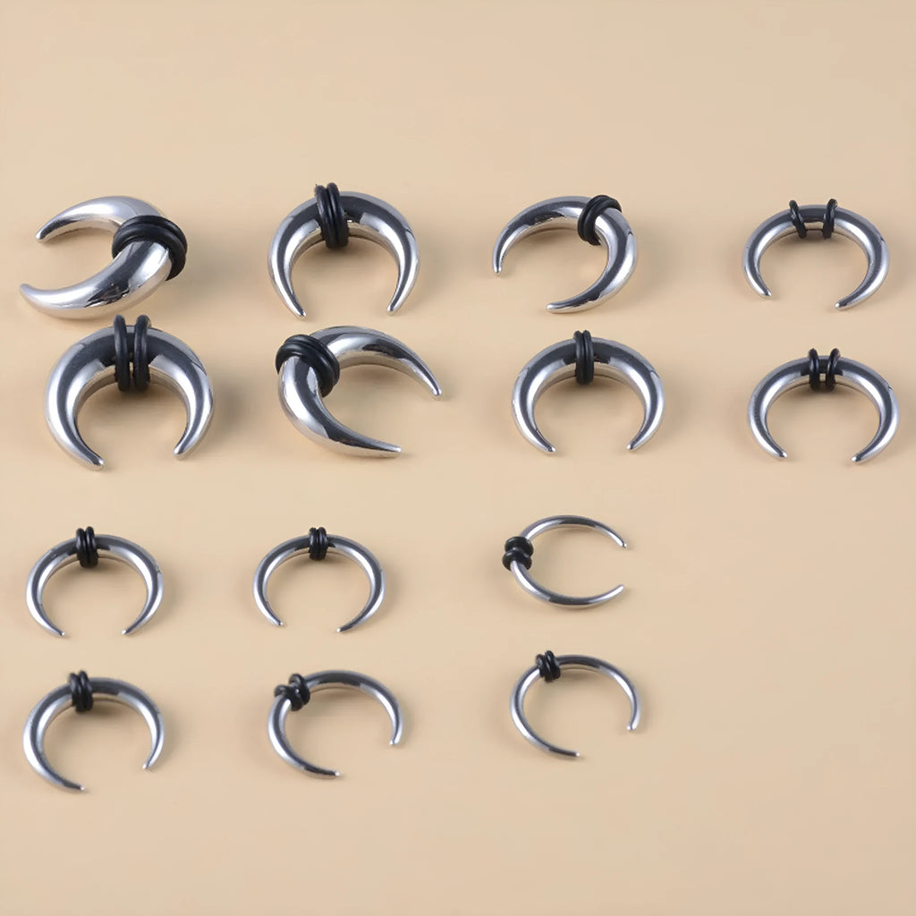 316 stainless steel C-shaped buffalo horn nose ring in black and steel colour on grey background.