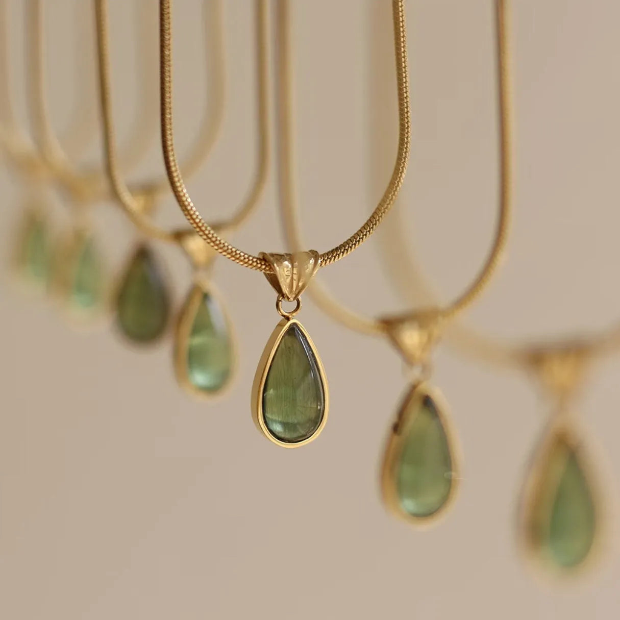 Retro water drop necklace with blue gemstone pendant on a titanium steel snake bone chain.