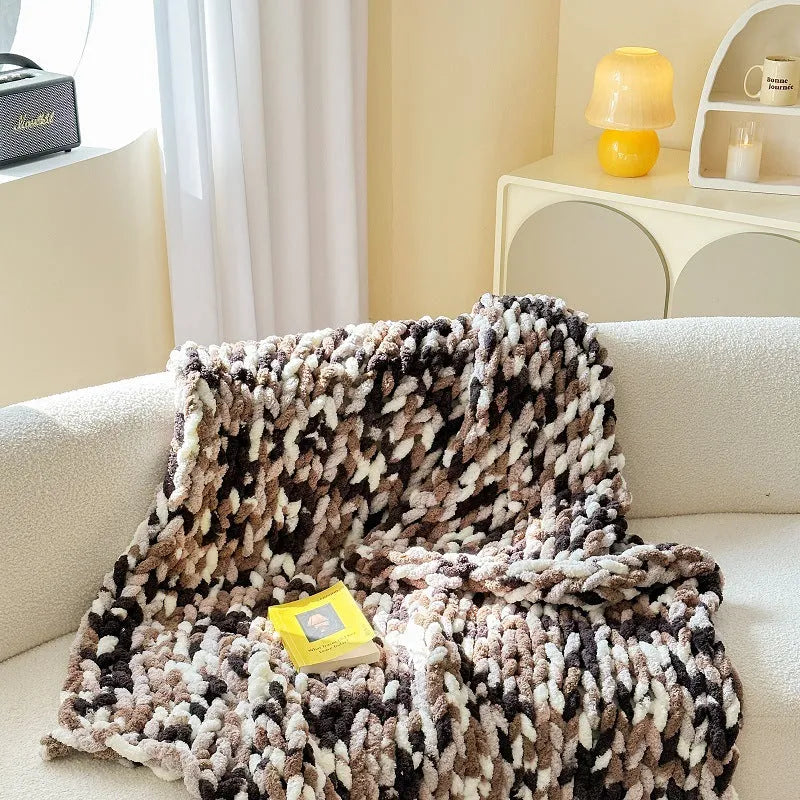 Thick striped chenille handmade blanket in a choice of four colours, shown on a double bed.
