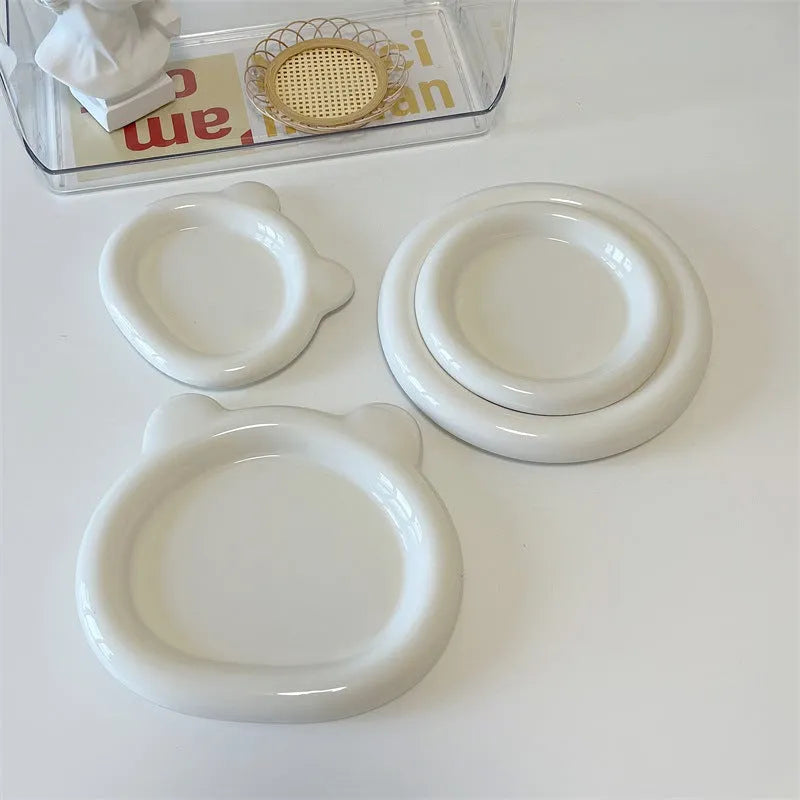 White porcelain plate with bear doodle or round doodle design, shown in 15cm and 20cm sizes.