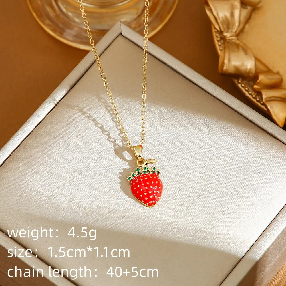 Delicate indie women's necklace with cherry, strawberry and pepper charms on a titanium steel O-ring chain.