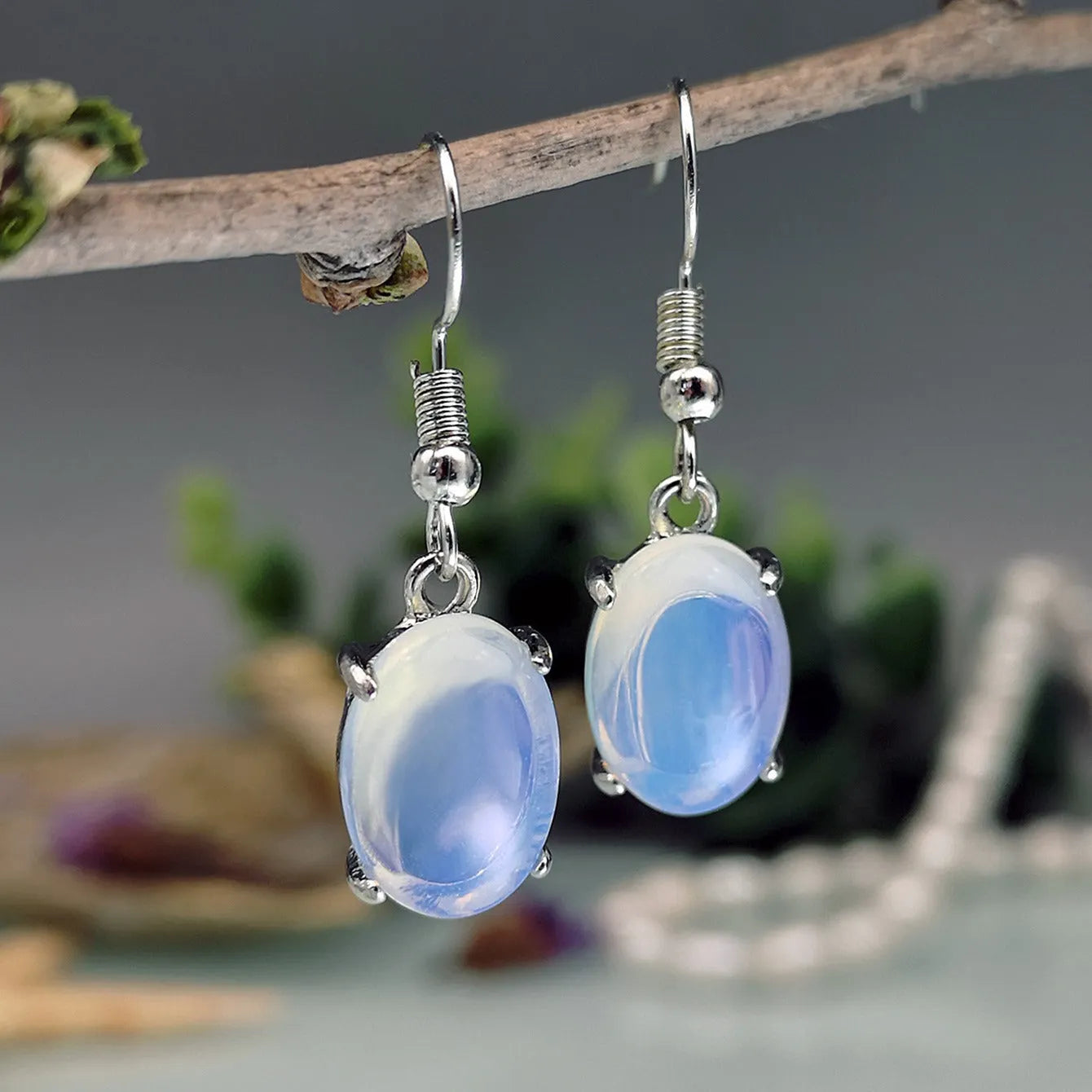 Opal earrings with retro moonstone cross design in drop shape and electroplated alloy construction