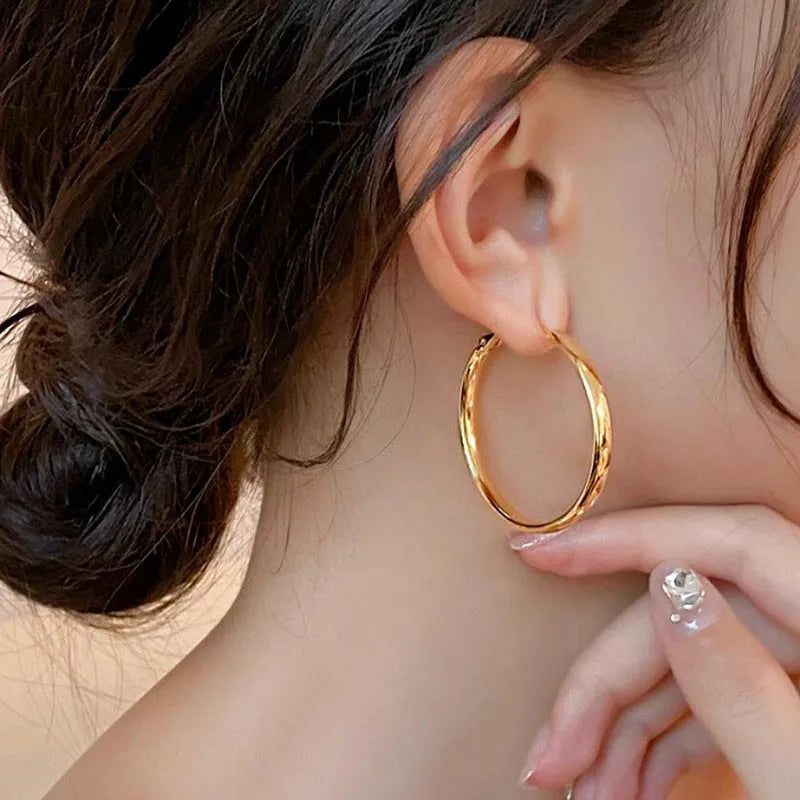 Gold and silver 40mm copper circle hoop earrings with electroplated finish