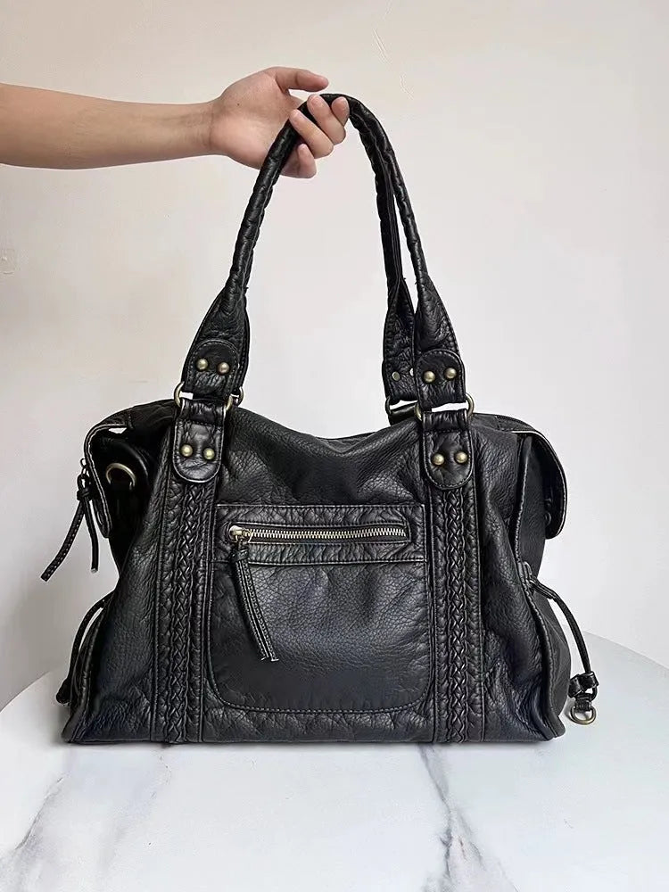 Women's brown retro motorcycle shoulder messenger bag with square shape and woven texture