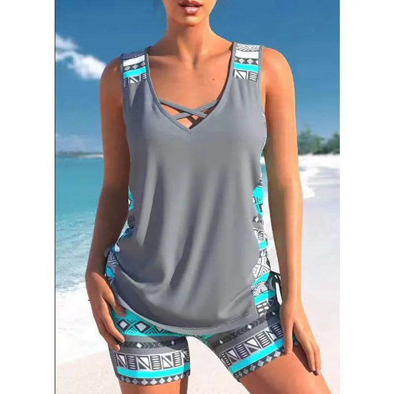 Women's blue floral printed lace two-piece bikini swimsuit on a mannequin.